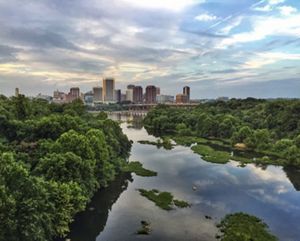 Arial view of a river with a city in the background.