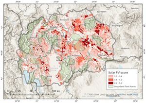 Topographic map of North Macedonia with areas highlighted in red showing potential for solar power siting and generation.