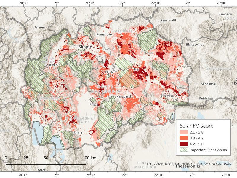 Topographic map of North Macedonia with areas highlighted in red showing potential for solar power siting and generation.