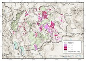 Topographic map of North Macedonia with areas highlighted in red showing potential for wind power siting and generation.