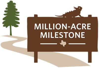 A sign with a horny toad sitting on top of it with the words million-acre milestone and a tree in the background.