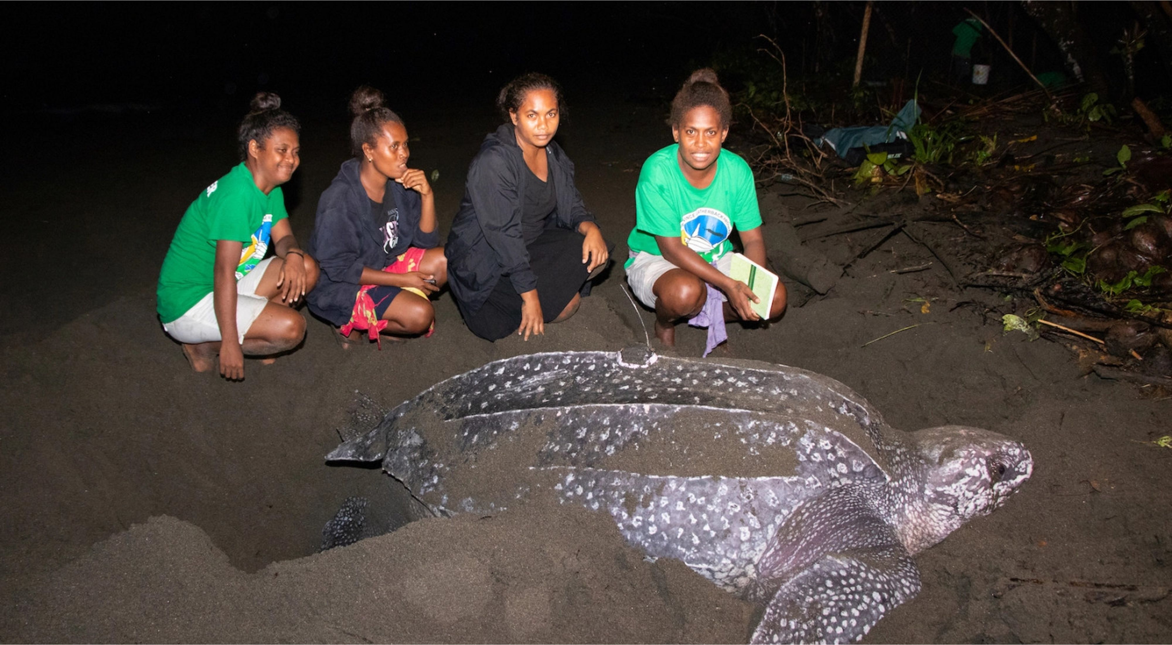 Local women with leatherback turtles