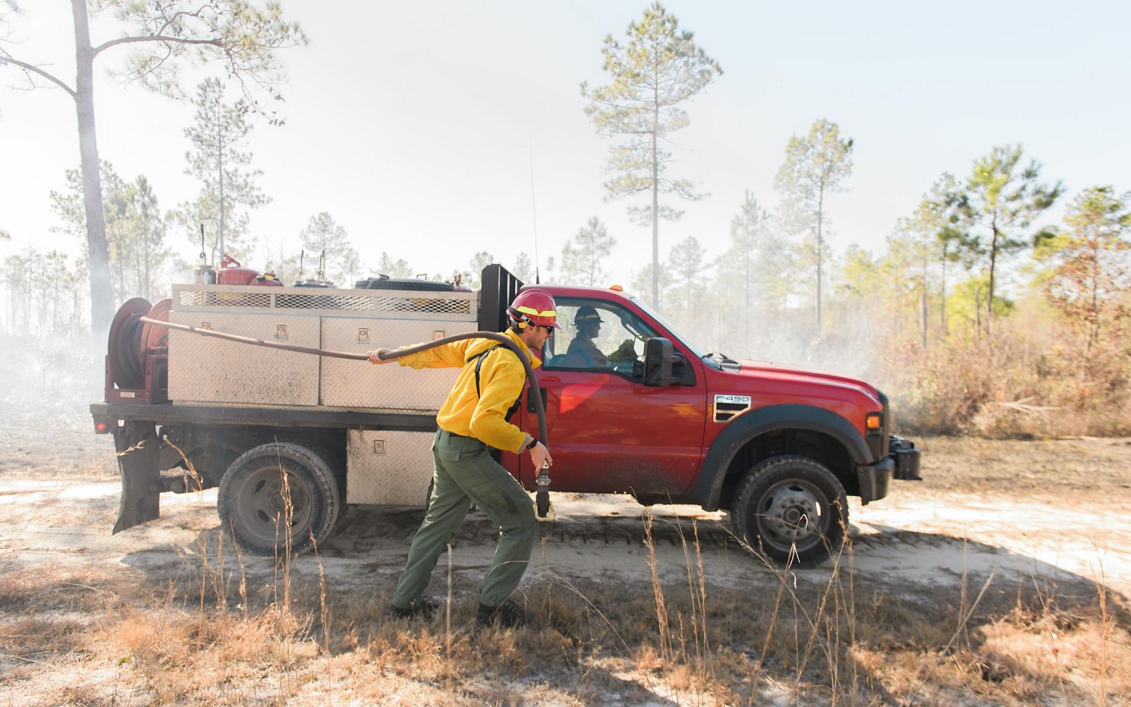 Wetting the fire lines of a controlled burn in North Carolina's Green Swamp.