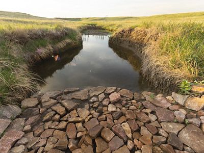A rock structure installed to prevent erosion.