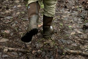 Boots over mucky ground.