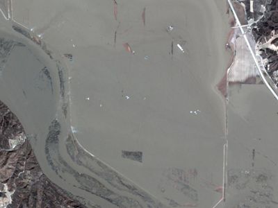 Satellite imagery showing river and flooded land.
