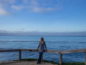 Heather Tallis on an overlook of the Pacific Ocean. 