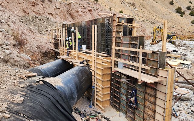 An image of a construction site in a river bank.