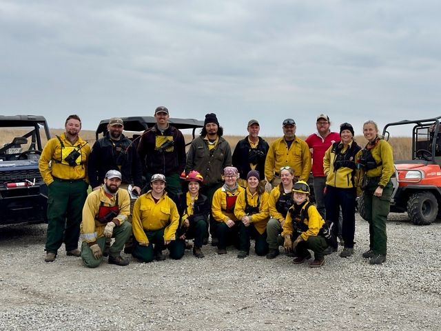 Group photo of fire crew at workshop.