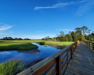Bridge over Upshur Creek at Brownsville Preserve. A wooden foot bridge extends over the marsh and shallow water of Upshur Creek on Virginia's Eastern Shore.