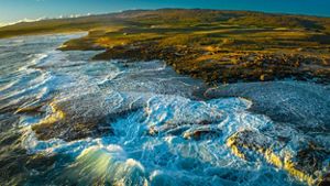 Aerial view of the coast of Mo‘omomi Beach Preserve.