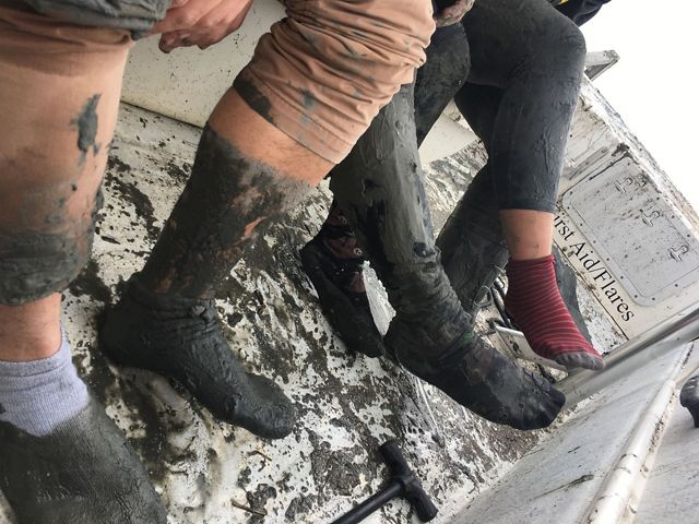 Four muddy, shoe-less feet 