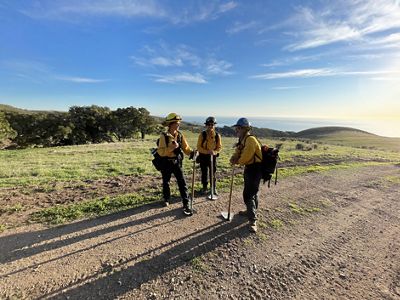 Prescribed fire crew assembles along a road.