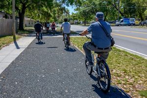 Bicyclers riding on a path.