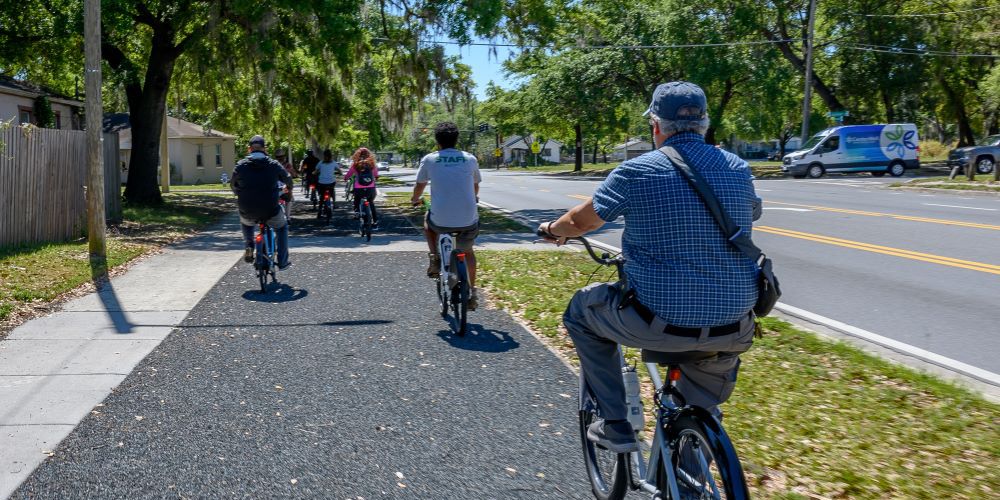 Bicyclers riding on a path.