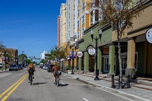 Cyclists riding down a main urban street.