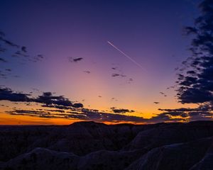 Jet Trail at sunset in Badlands National Park