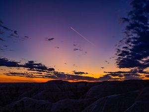 Jet Trail at sunset in Badlands National Park