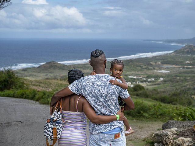 Family overlooking hill in Barbados