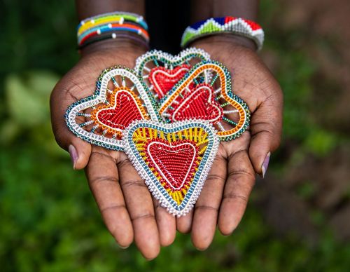 beaded ornaments in a hand