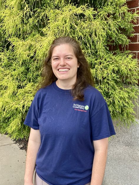 Headshot of Caitlin Embly.
