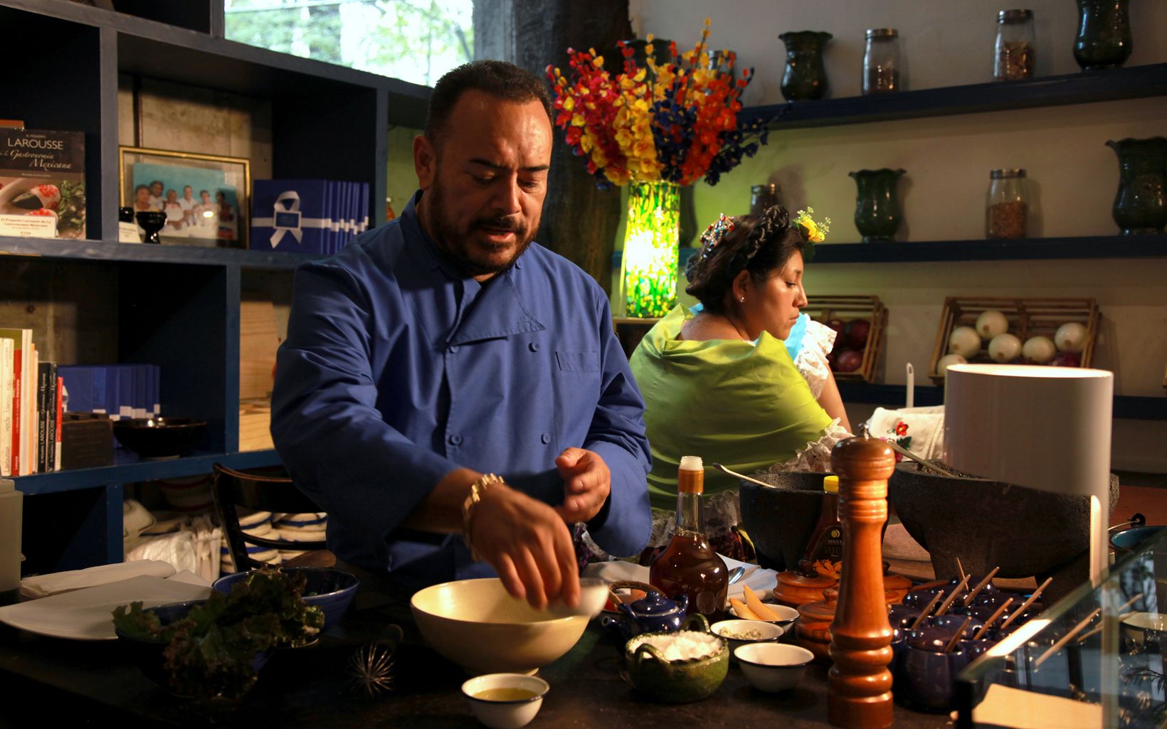Mexican c hef Ricardo Munoz prepares a dish in his kitc