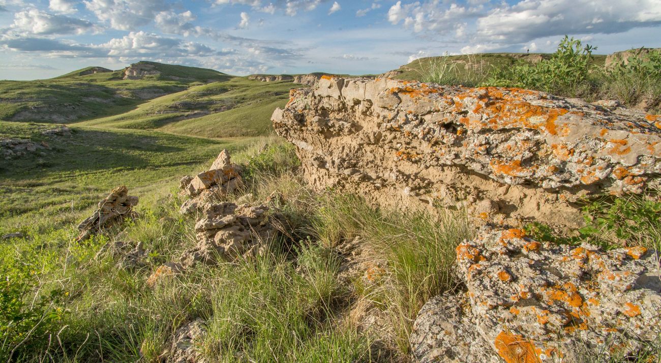 Rock escarpments in a rolling, native grassland.