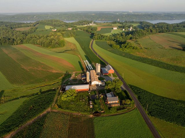 Aerial view of a farm near a winding river.