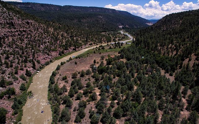 Photo of a sweeping view of Rio Chama river between mountains in New Mexico. 