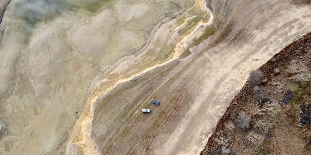 An aerial view of a dry lake in New Zealand.