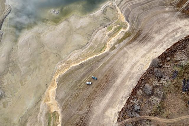 aerial image of desert and water meeting.