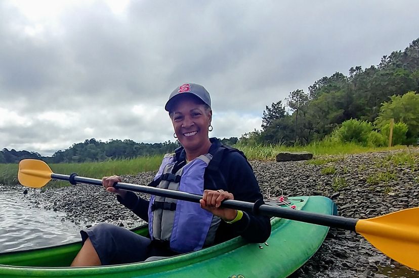 Dale Threatt-Taylor, State Director of TNC in South Carolina, in a kayak on the Wando River while preparing for a donor kayaking event.