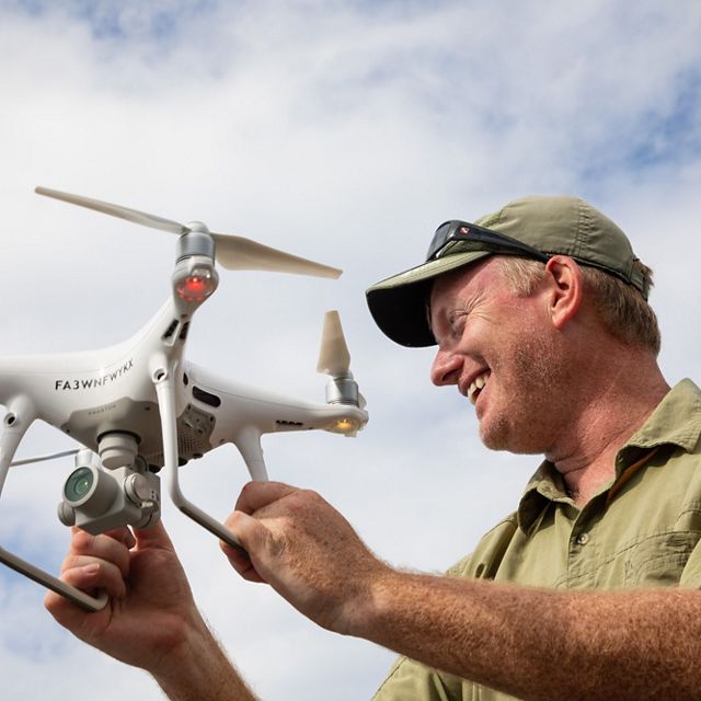Dr. Steve Schill, Lead Scientist for TNC in the Caribbean, prepares a drone for launch. This will validate and verify the accuracy of the satellite and aerial mapping.