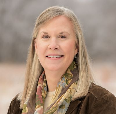 TNC Utah State Director Elizabeth Kitchens with blurred winter vegetation in background.