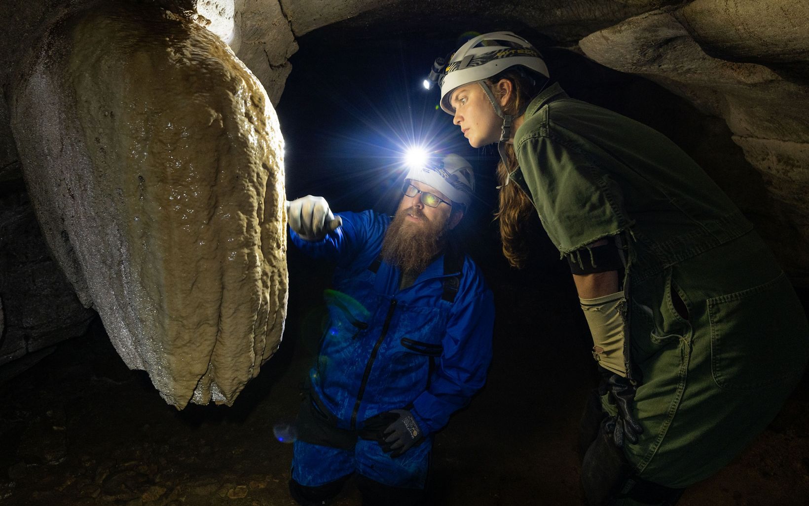 
                
                  Deep Dive Holliday shows journalist Lindsey Liles a stalactite in Coleman Cave
                  © Stephen Alvarez
                
              