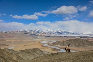 Mongolia’s Altai Mountains (with Kazakh golden eagle hunter in the foreground) 
