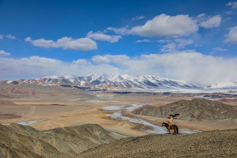 Mongolia’s Altai Mountains (with Kazakh golden eagle hunter in the foreground) 