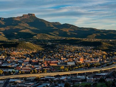 An aerial of the town of Trinidad, Colorado, with Fishers Peak in the background. 