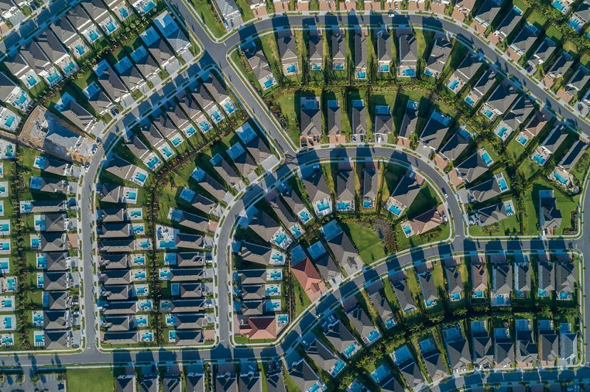 aerial of cookie cutter housing development with pools and small yards in sprawling surburbia of orlando florida