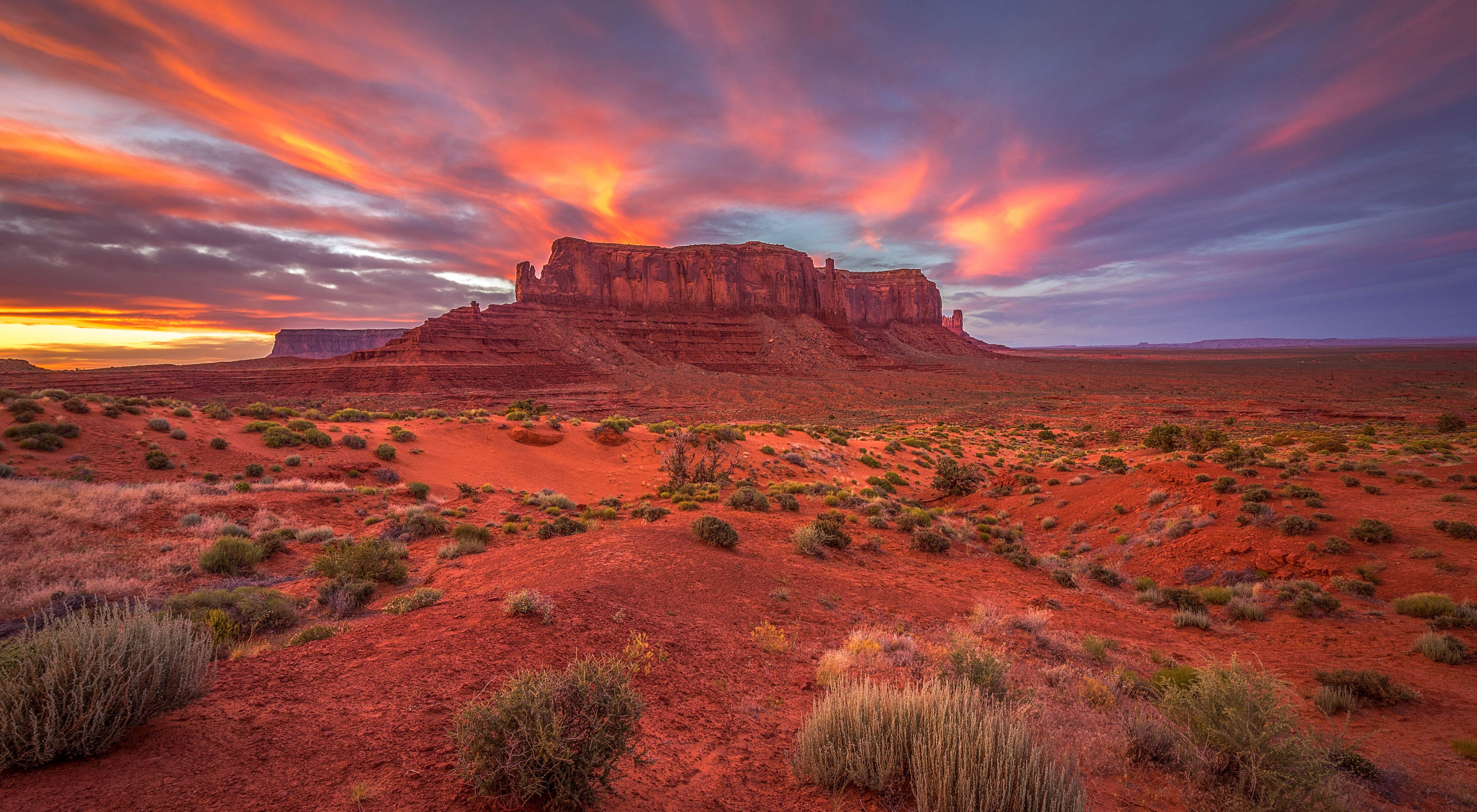 Sentinel Mesa in Monument Valley at sunset.
