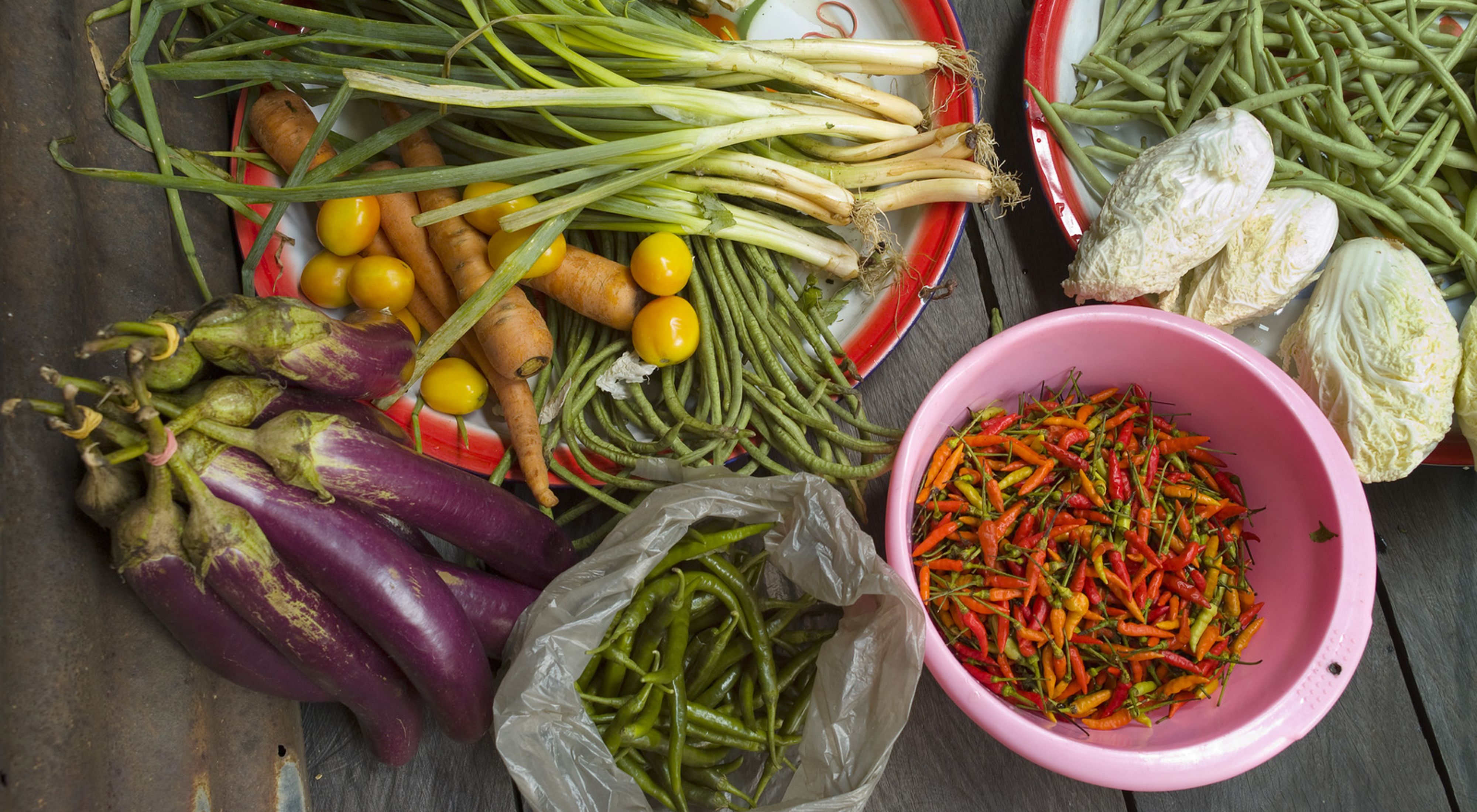 Locally grown and collected vegetables sorted for cooking at Long Laay (Long Laai) village which is situated on the banks of the Sagah River in the Bornean forest of the Berau district, East Kalimantan, Borneo, Indonesia. 