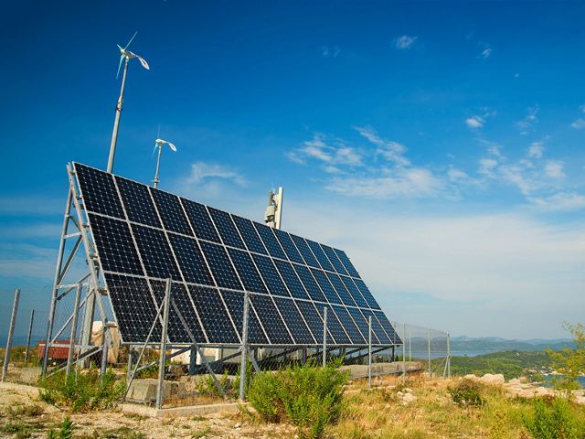 a small solar panel on top of a mountain in the Adriatic sea