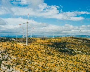 wind turbines dotting yellow rolling hills in Croatia
