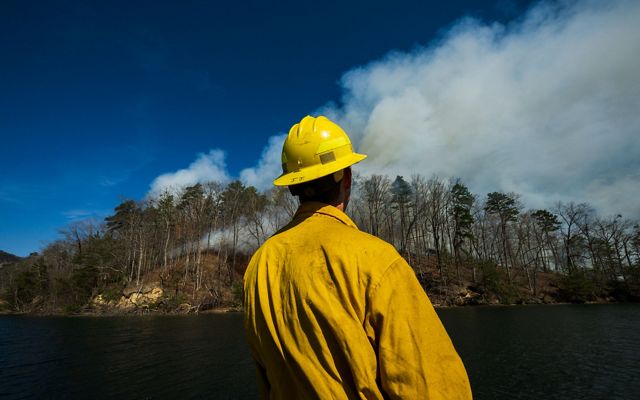 Conservation tech Austin Wiliams observes a controlled burn.