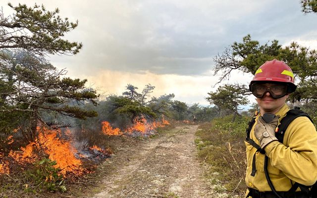 TNC Virginia's Matt Zabik monitors a fire line in May 2021 during a controlled burn in the Allegheny Highlands—monitoring good fire to enhance healthy forests. 