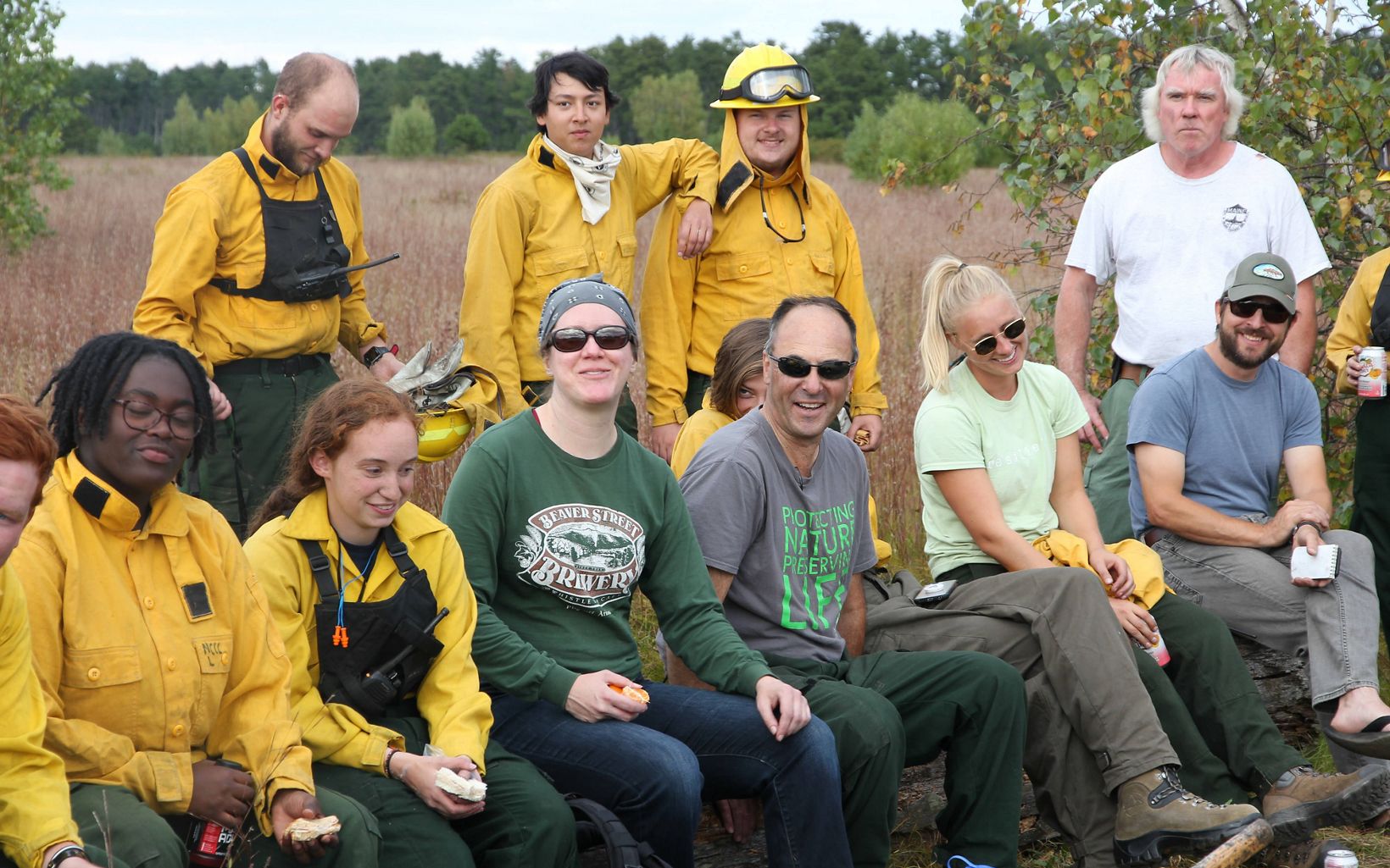 Prescribed fire crew team members relaxing after a controlled burn at Kennebunk Plains Preserve.