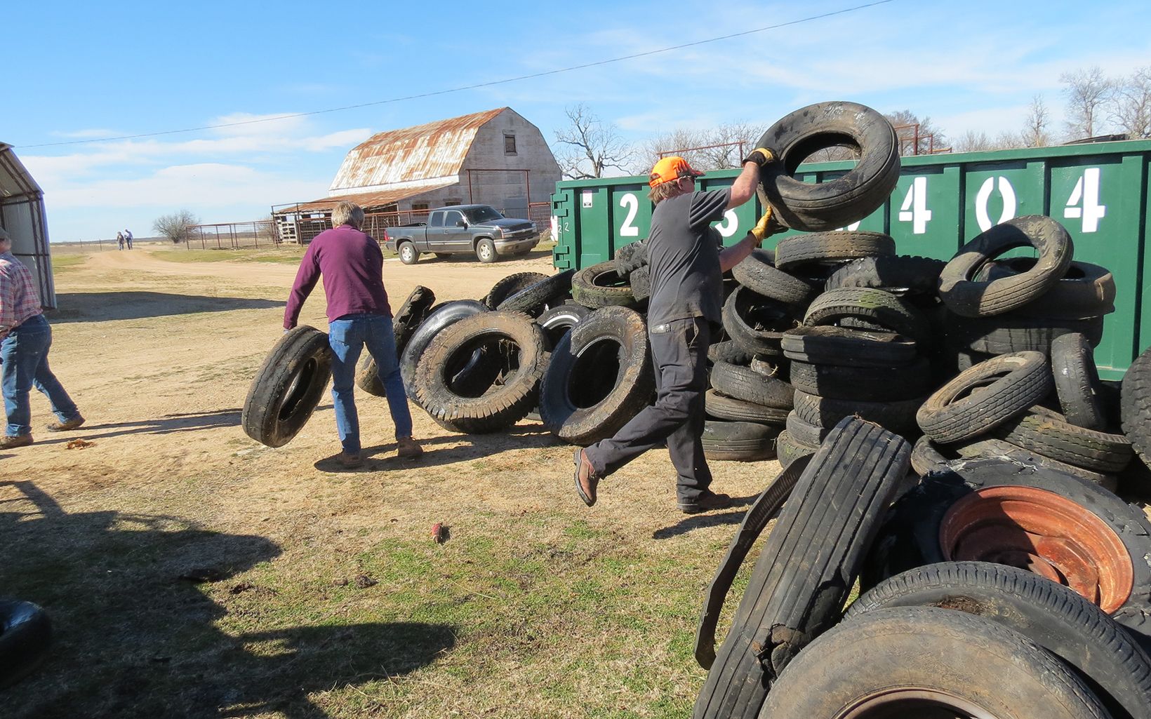 Volunteers gathering tires along Blue River