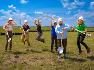 TNC staff jump for joy at the Kankakee Sands groundbreaking!