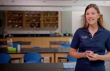 Photo of Kathy Terry in a navy blue polo shirt.