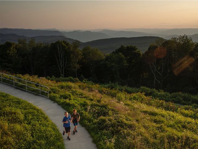 Children run on a path in a protected, conservation area in Kentucky.